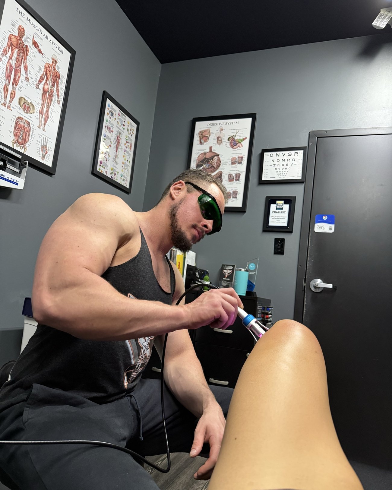 Class 4 laser therapy applied to a patient's knee at Alpha Care in Crestview, Florida